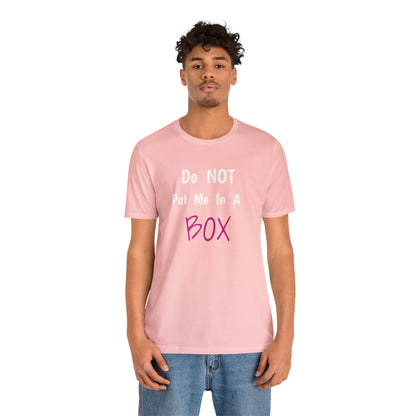 A man wearing a pink unisex DO NOT PUT ME IN A BOX.