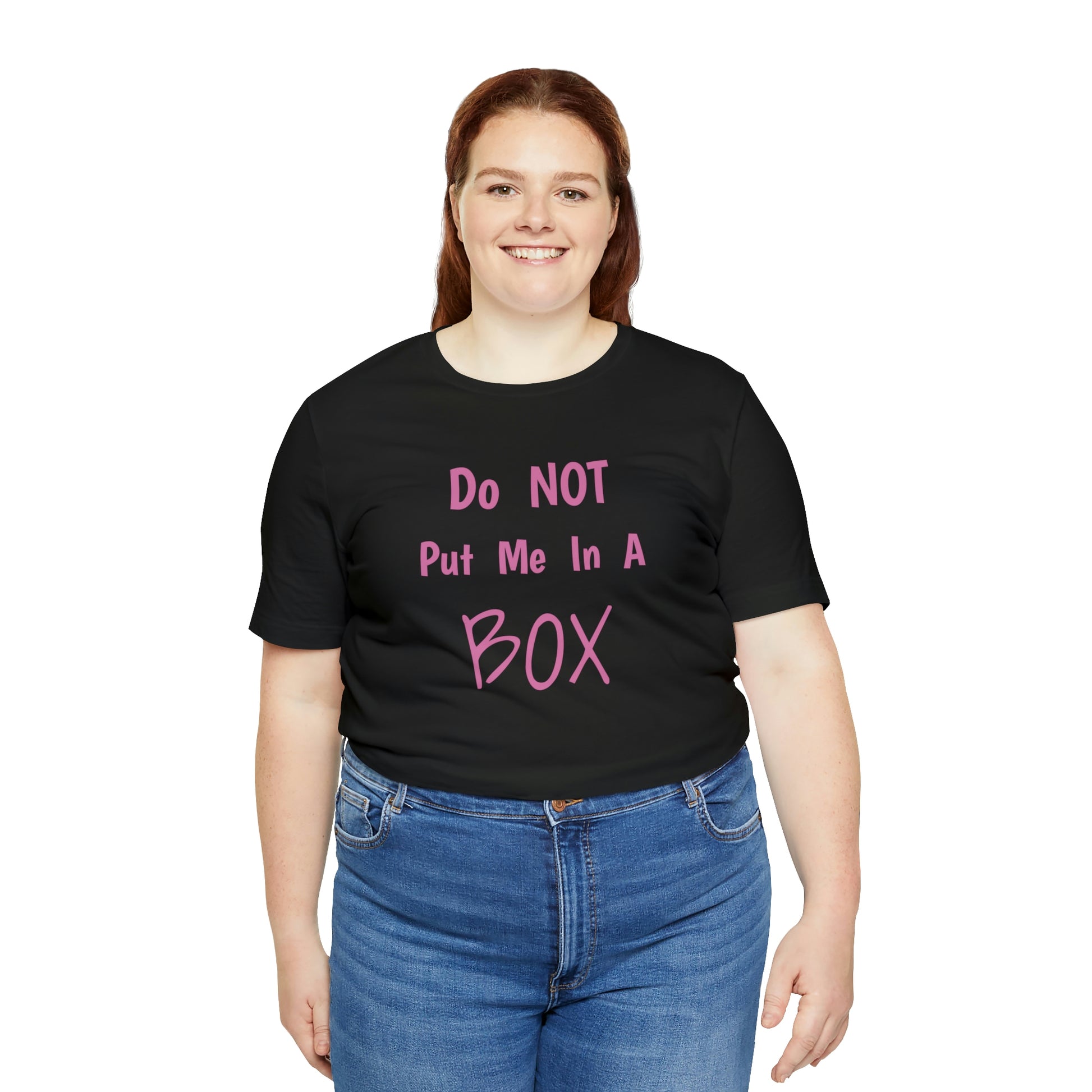 A woman wearing the DO NOT PUT ME IN A BOX cotton t-shirt in retail fit.