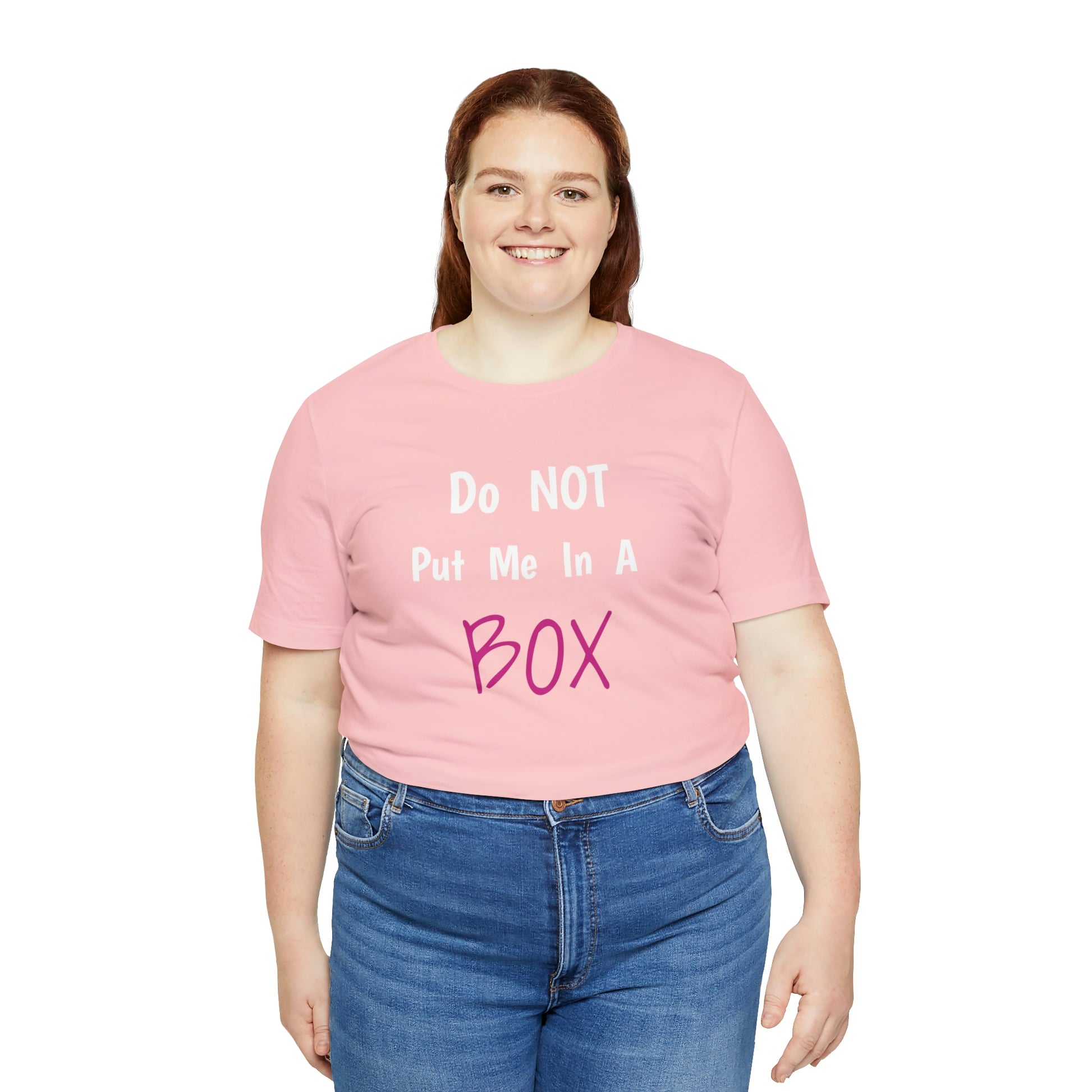 A woman wearing a well-loved favorite pink t-shirt that says DO NOT PUT ME IN A BOX.