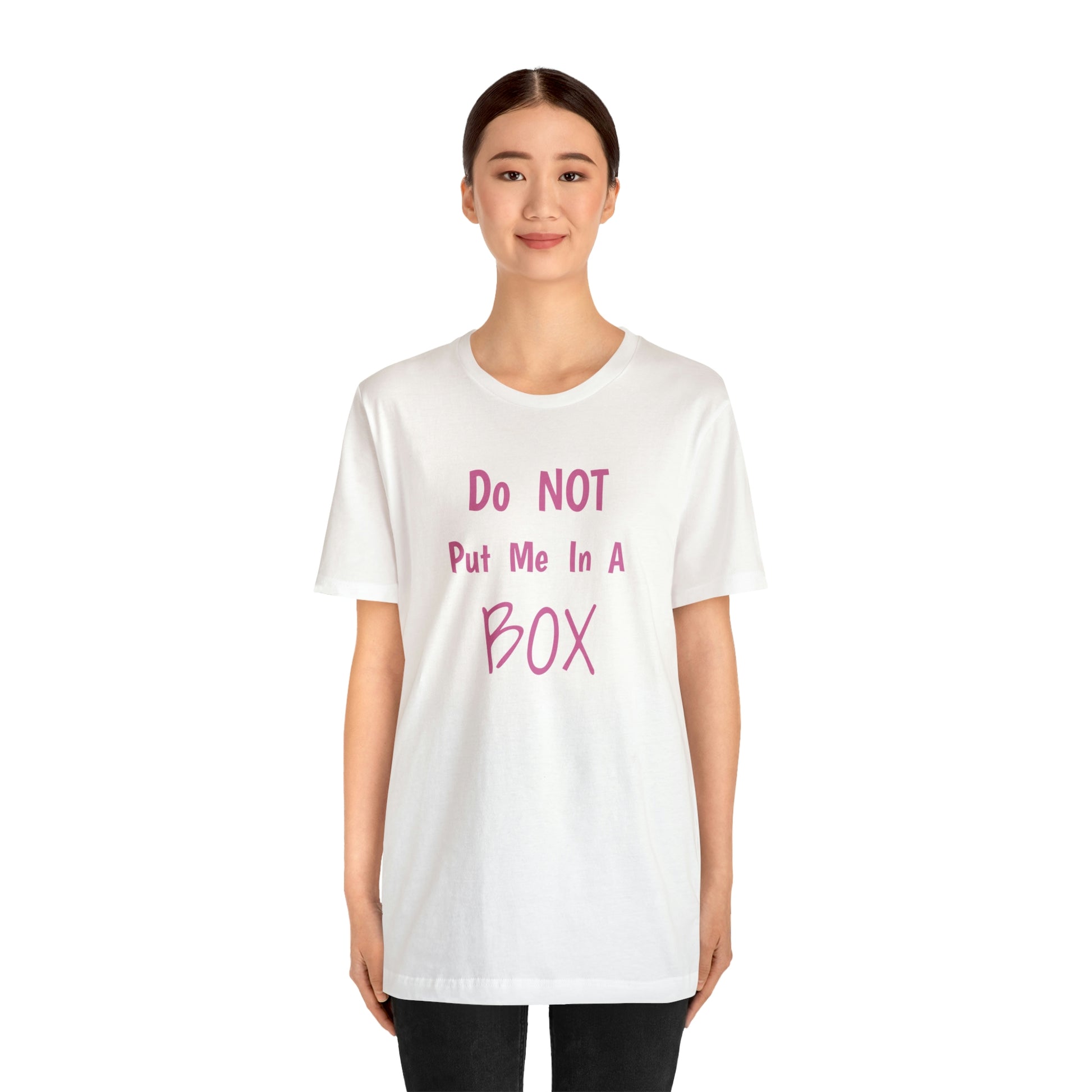 A woman wearing a white t-shirt with a quality print saying "DO NOT PUT ME IN A BOX".