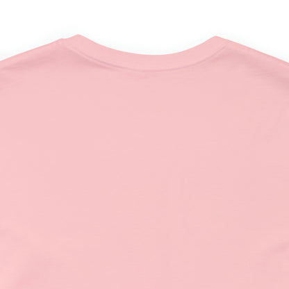 A pink cotton DO NOT PUT ME IN A BOX tee shirt.