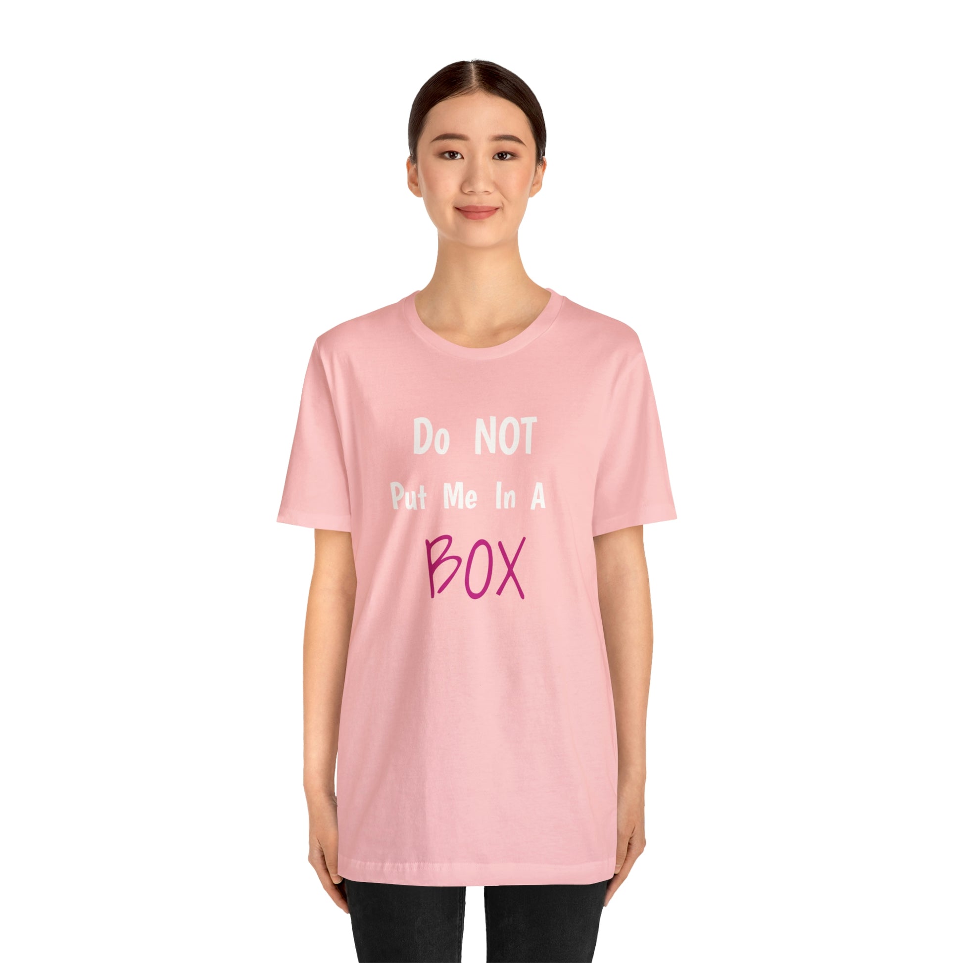 A woman wearing a cotton t-shirt that says "DO NOT PUT ME IN A BOX".