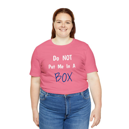 A woman wearing a unisex pink jersey tee that says DO NOT PUT ME IN A BOX.