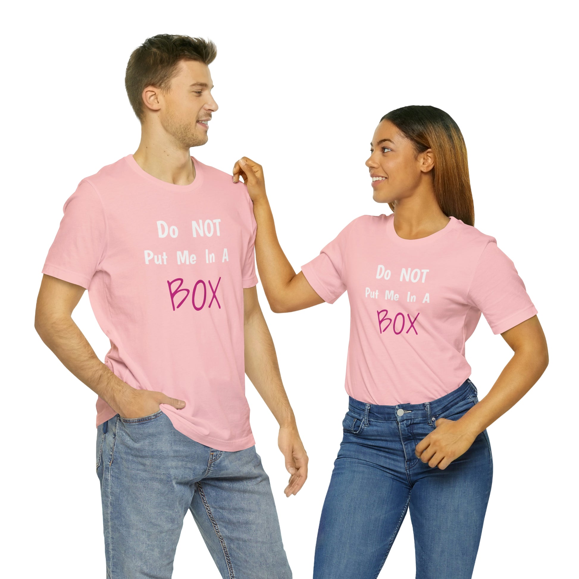 Unisex "DO NOT PUT ME IN A BOX" tee with a quality print showing a man and woman wearing a pink t-shirt.